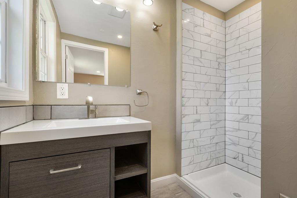 333 Berlin Road Marlborough, MA 01752 - Photo 18 of 32 a bathroom with a sink a toilet and shower