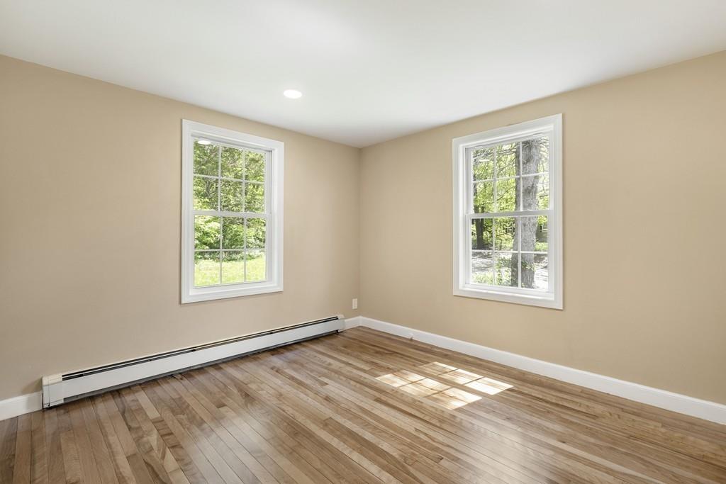 333 Berlin Road Marlborough, MA 01752 - Photo 19 of 32 a view of an empty room with wooden floor and a window