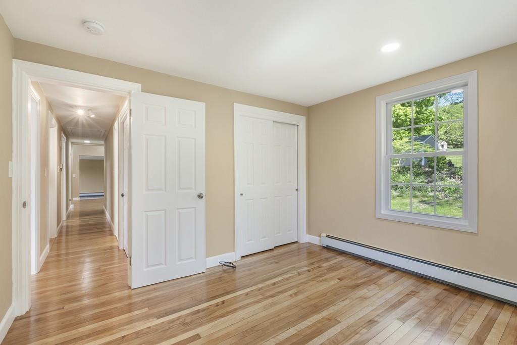 333 Berlin Road Marlborough, MA 01752 - Photo 20 of 32 an empty room with wooden floor and windows