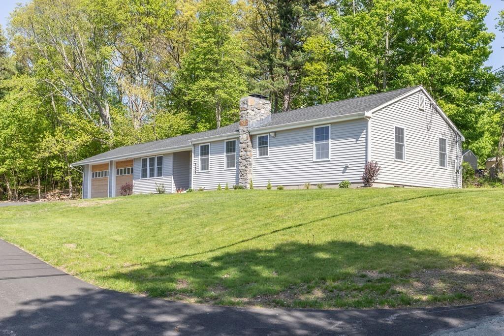 333 Berlin Road Marlborough, MA 01752 - Photo 2 of 32 a view of a yard in front of a house with large trees