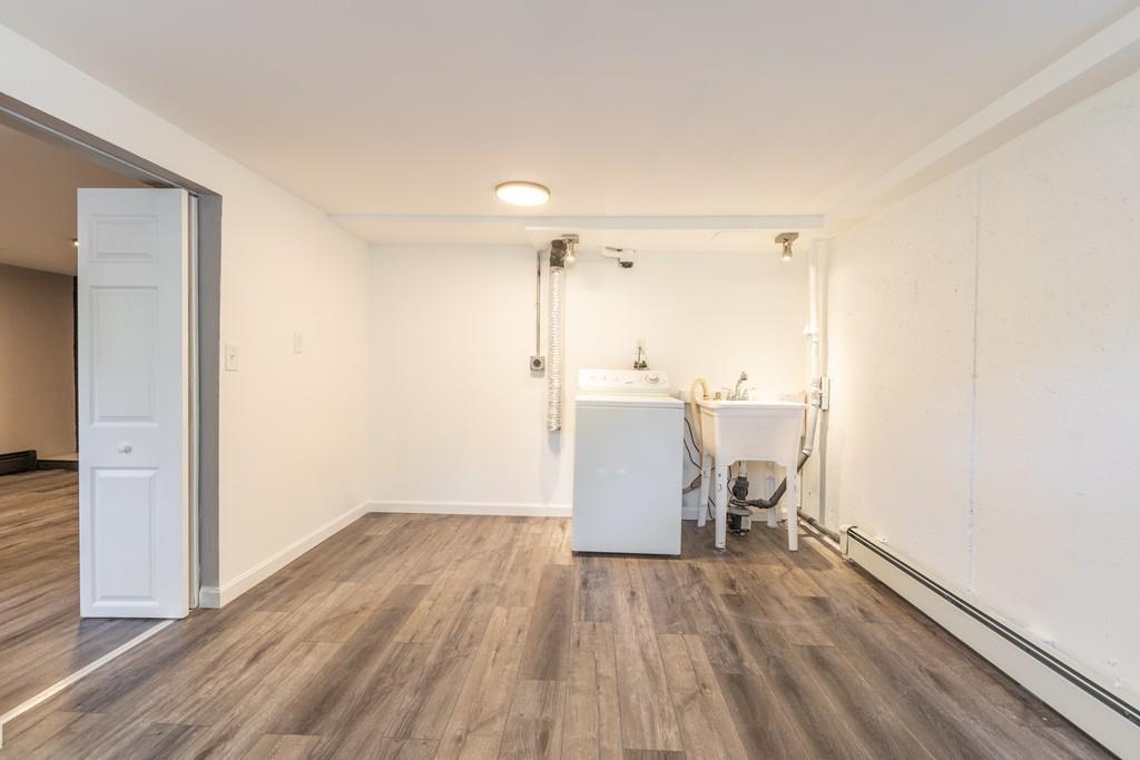 333 Berlin Road Marlborough, MA 01752 - Photo 27 of 32 a view of a kitchen with a sink and dishwasher with wooden floor