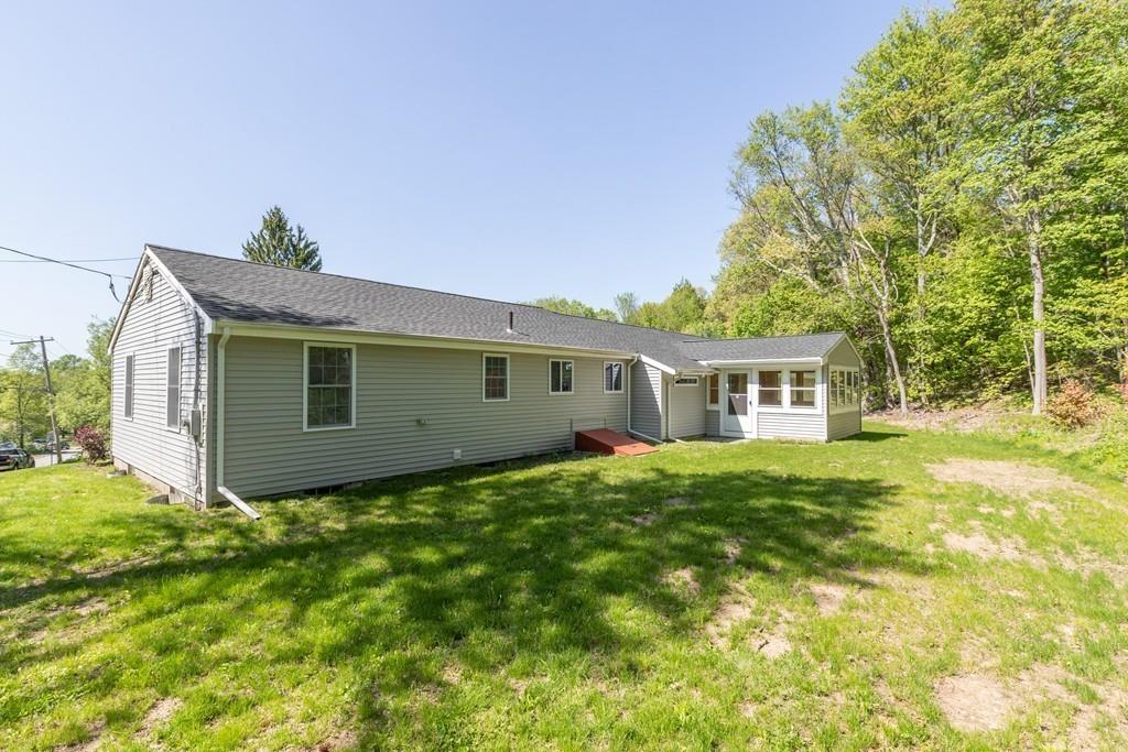 333 Berlin Road Marlborough, MA 01752 - Photo 28 of 32 a view of a yard in front of a house with large trees