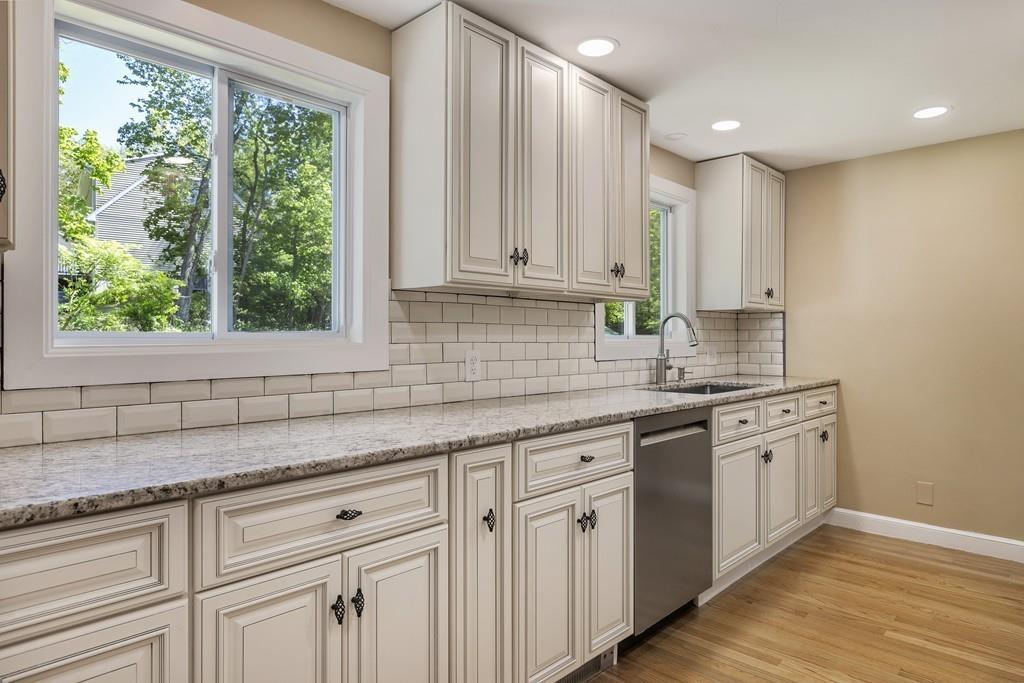 333 Berlin Road Marlborough, MA 01752 - Photo 3 of 32 a kitchen with granite countertop white cabinets and a window