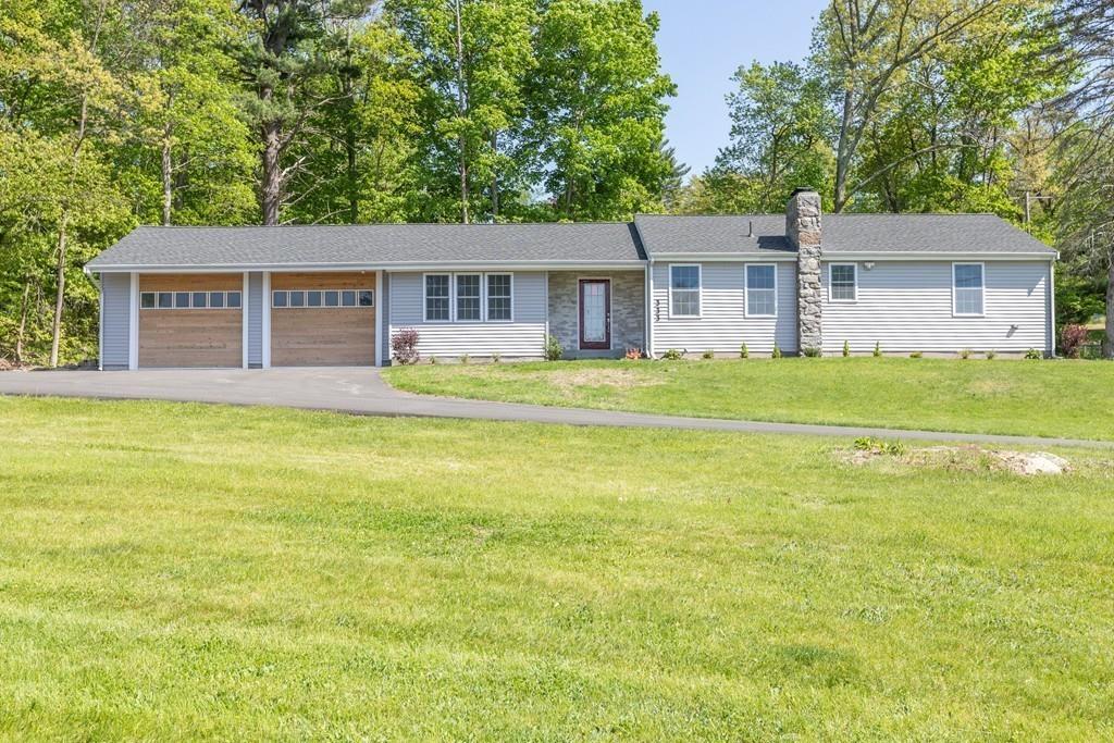 333 Berlin Road Marlborough, MA 01752 - Photo 32 of 32 front view of a house next to a big yard