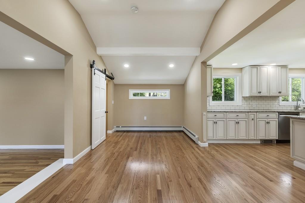 333 Berlin Road Marlborough, MA 01752 - Photo 6 of 32 a view of an empty room with wooden floor and a window