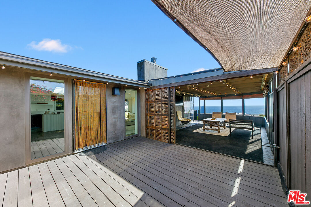 29500 Heathercliff Road, Unit 159 Malibu, CA 90265 - Photo 11 of 37 a view of a patio with wooden floor
