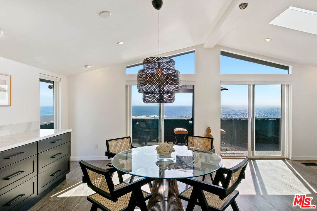 29500 Heathercliff Road, Unit 159 Malibu, CA 90265 - Photo 5 of 37 a view of a dining room with furniture and window