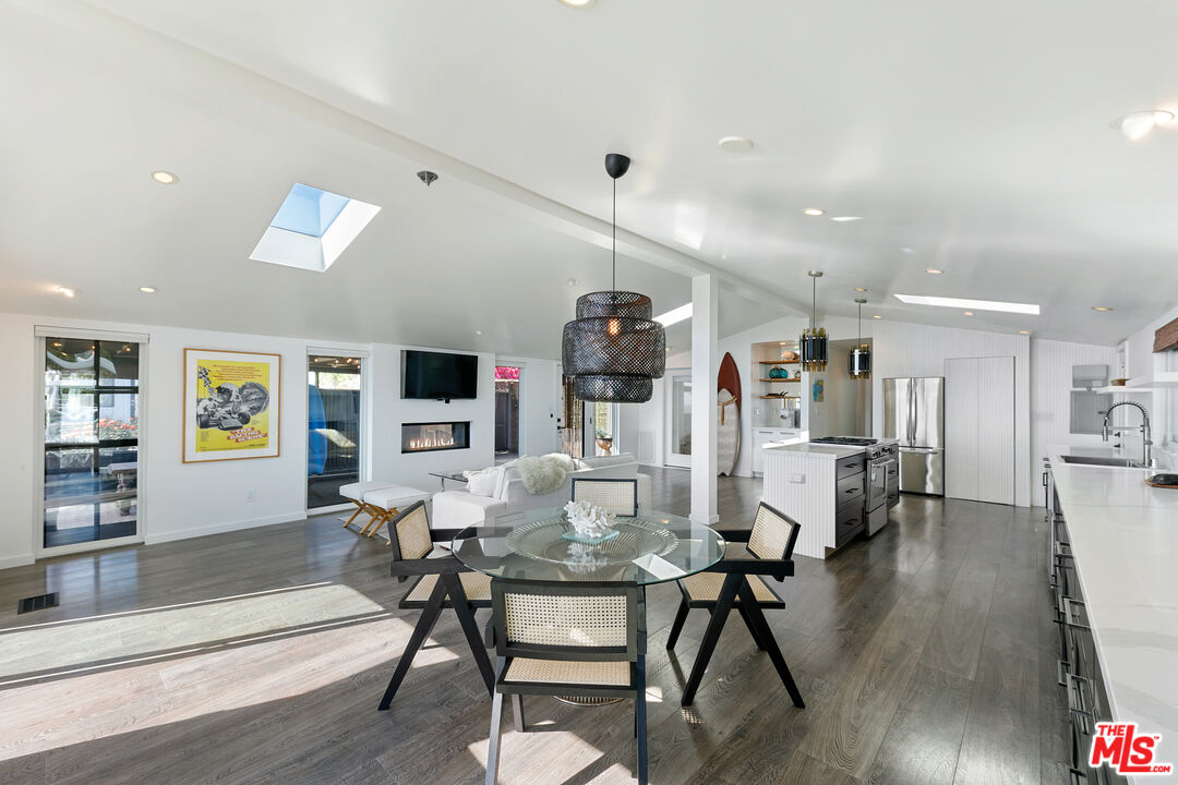 29500 Heathercliff Road, Unit 159 Malibu, CA 90265 - Photo 9 of 37 a living room with furniture and wooden floor
