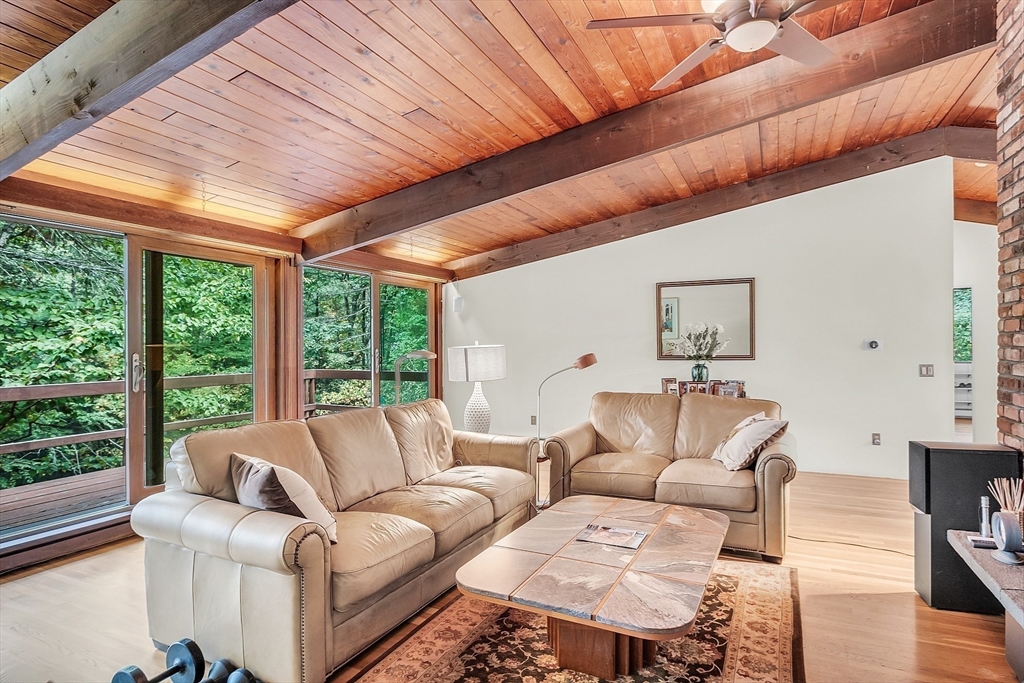 191 Heald Road Carlisle, MA 01741 - Photo 11 of 32 a living room with furniture and a large window