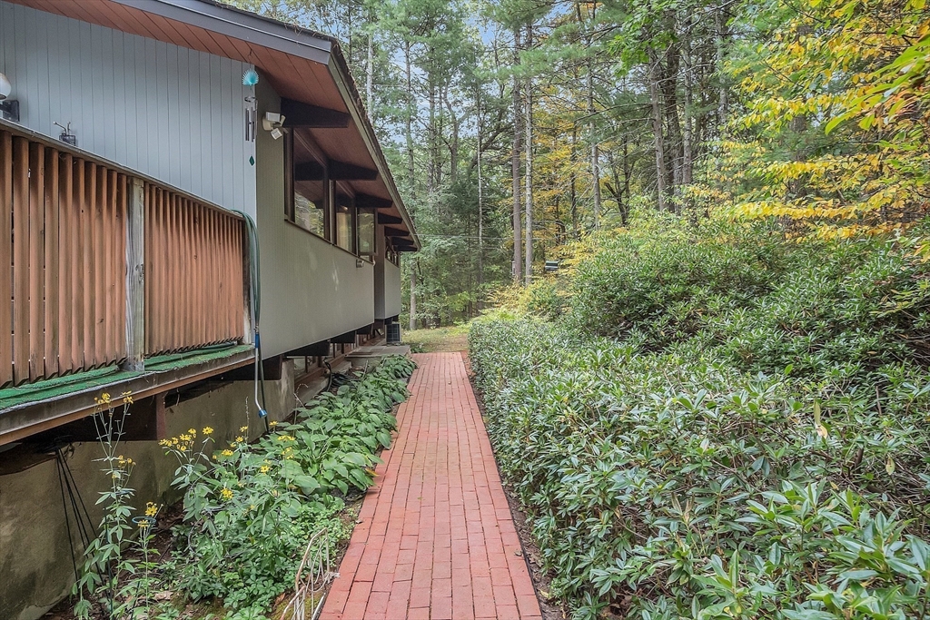 191 Heald Road Carlisle, MA 01741 - Photo 3 of 32 a view of a pathway of a house with a yard