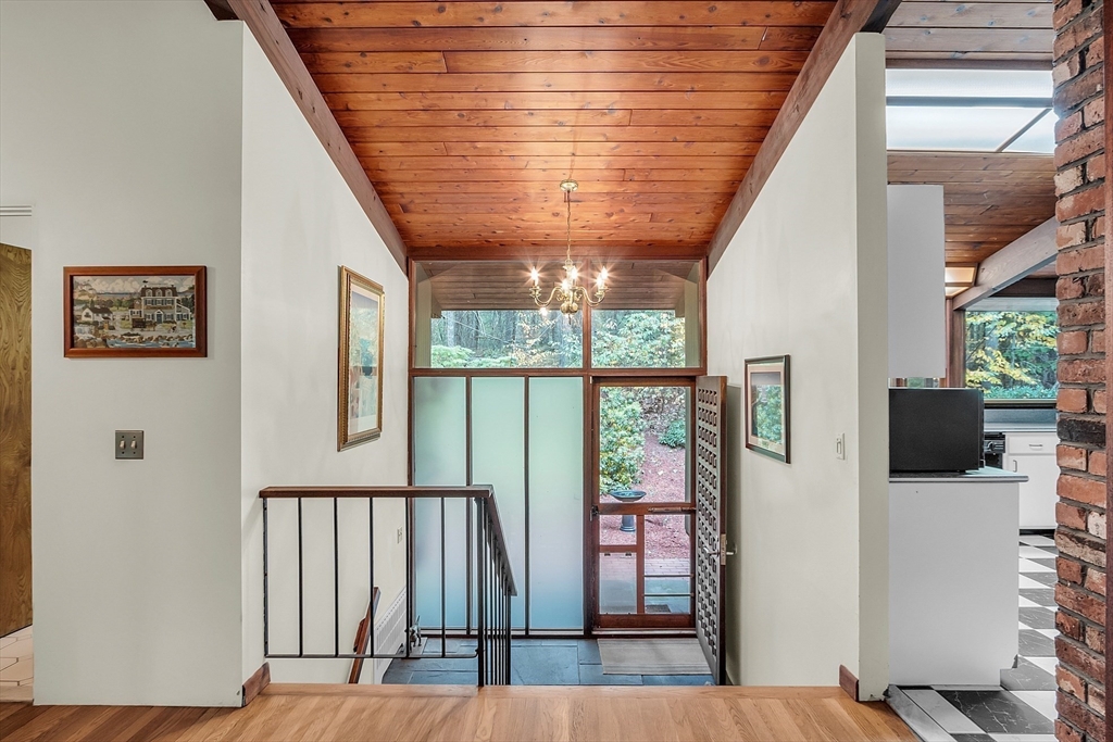 191 Heald Road Carlisle, MA 01741 - Photo 8 of 32 a view of a hallway with wooden floor and an entryway