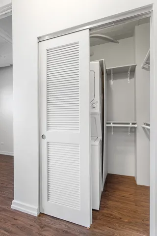 a view of a room with wooden floor
