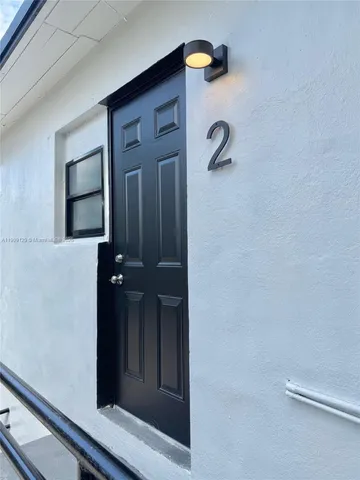 a kitchen with stainless steel appliances a stove a refrigerator and a microwave