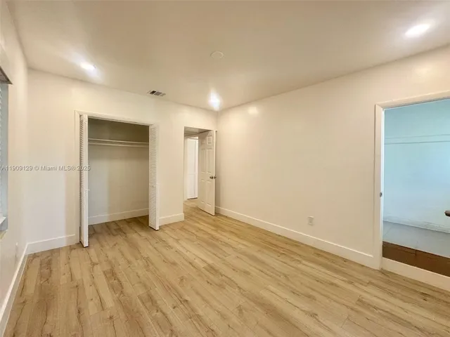 a kitchen with stainless steel appliances a refrigerator stove and microwave