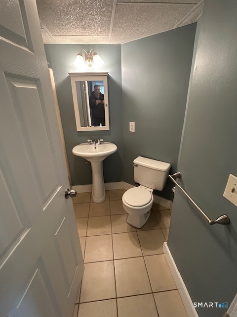 40 A High Street Winchester, CT 06098 - Photo 6 of 10 a bathroom with a toilet sink and mirror