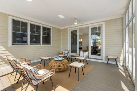 a outdoor space with patio the couches and a dining table with balcony view