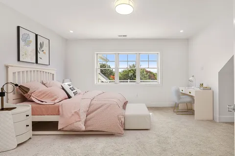 a bedroom with a bed and a couch