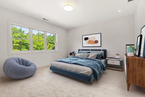 a bedroom with a bed and a couch