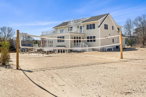 a front view of a house with a swimming pool