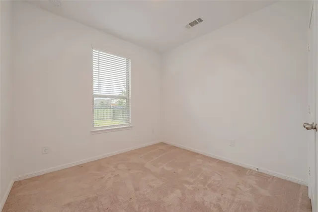 a bathroom with a sink a toilet and a large mirror
