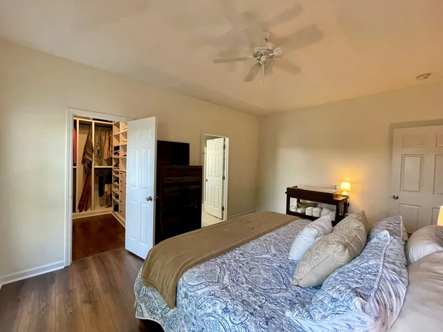 a bedroom with a bed and a closet