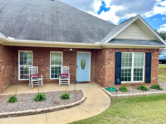 front view of a house with a patio