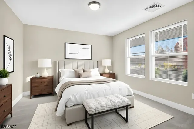 a kitchen with stainless steel appliances kitchen island granite countertop a stove a sink and a refrigerator