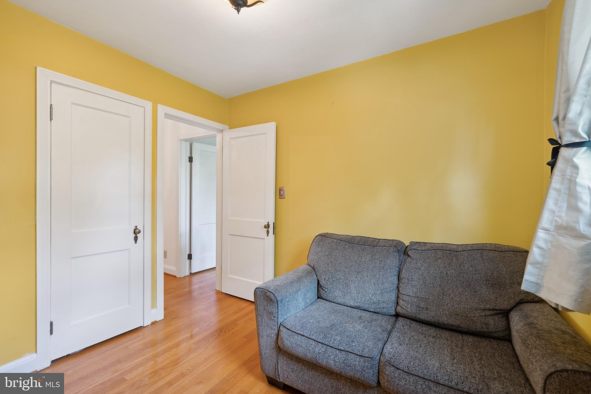 411 Overbrook Road Catonsville, MD 21228 - Photo 13 of 19 a living room with a couch and a ceiling fan