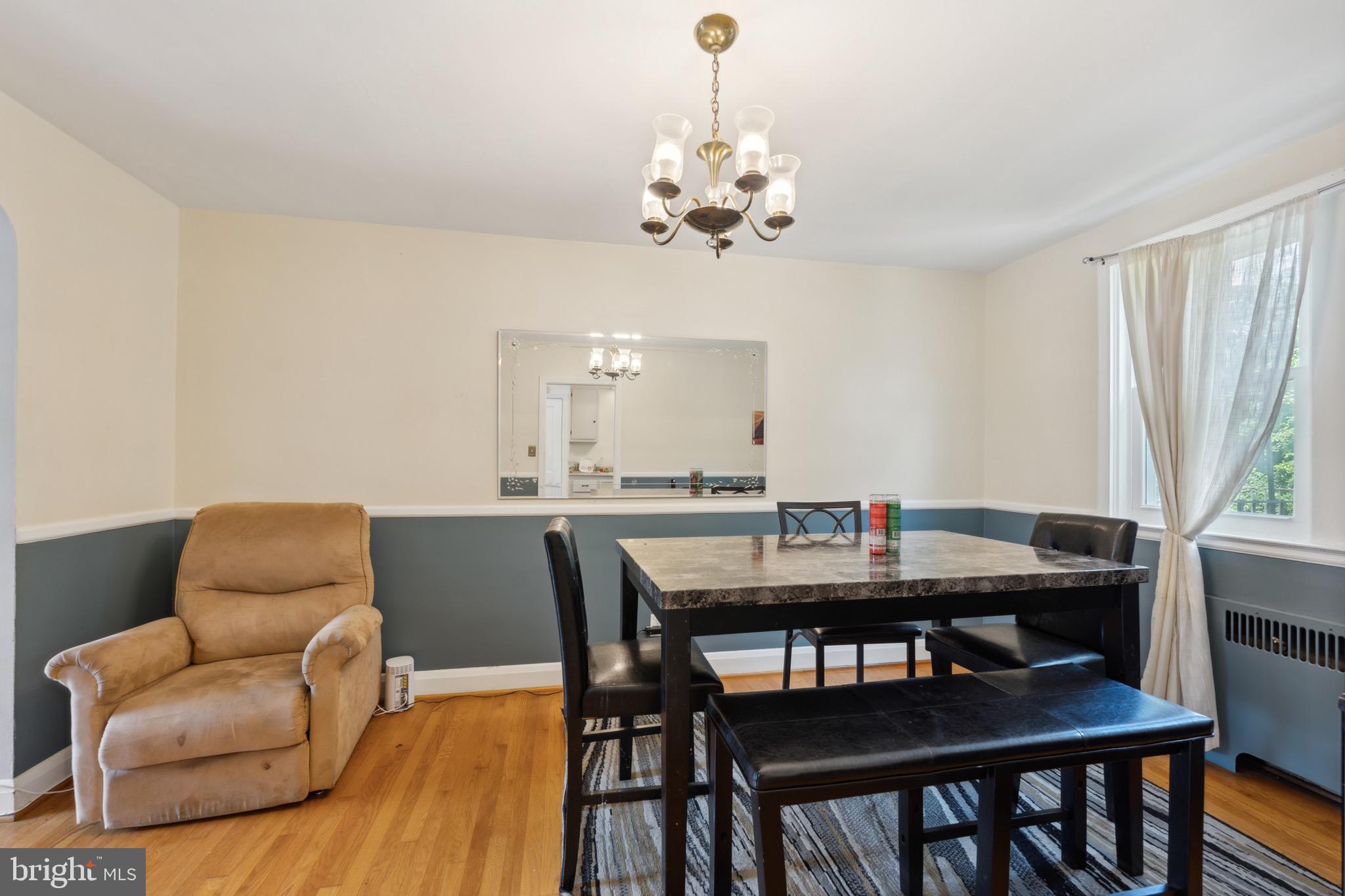 411 Overbrook Road Catonsville, MD 21228 - Photo 5 of 19 a view of a dining room with furniture window and wooden floor