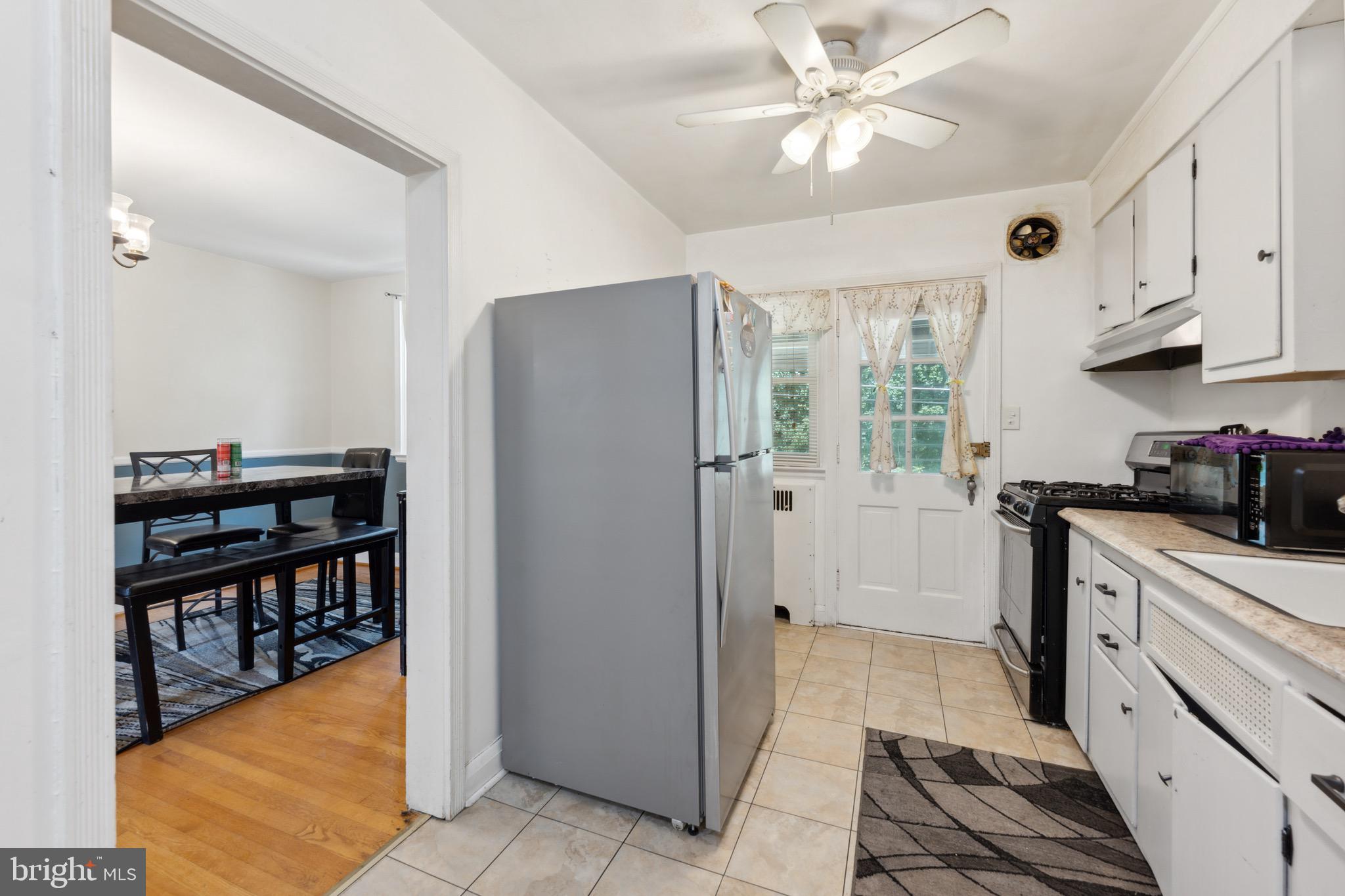 411 Overbrook Road Catonsville, MD 21228 - Photo 7 of 19 a kitchen with stainless steel appliances granite countertop a refrigerator and a stove top oven