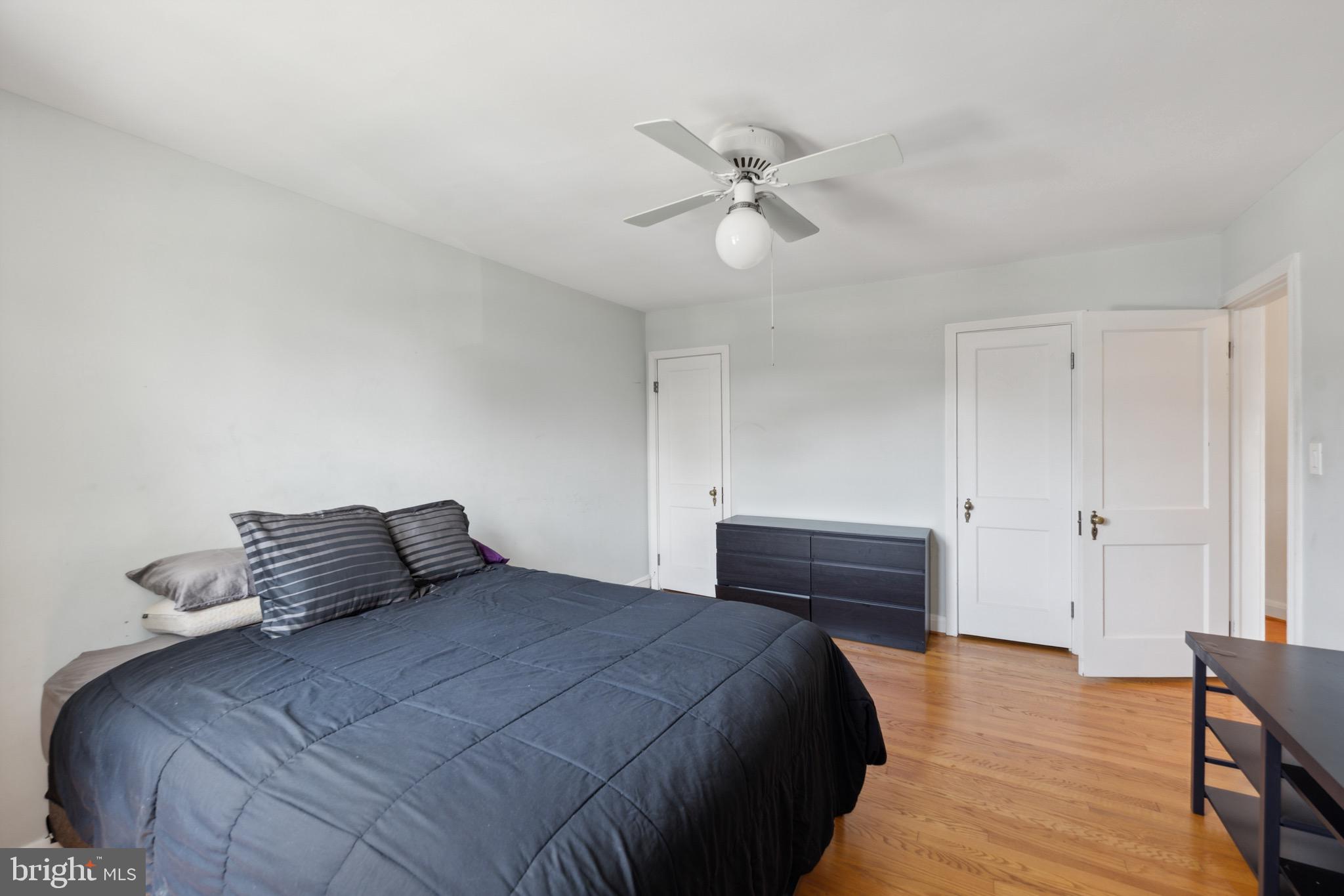 411 Overbrook Road Catonsville, MD 21228 - Photo 9 of 19 a bedroom with a bed and wooden floor
