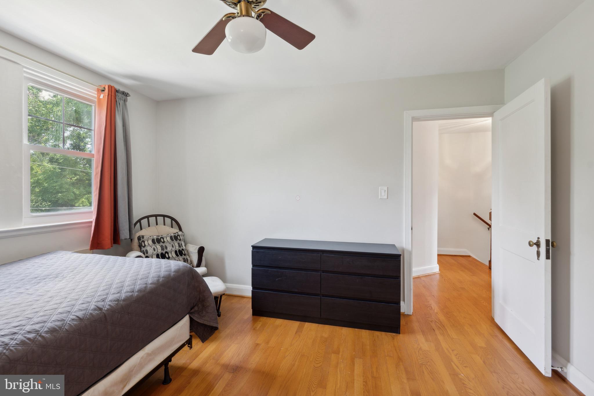 411 Overbrook Road Catonsville, MD 21228 - Photo 10 of 19 a bedroom with a bed and a dresser