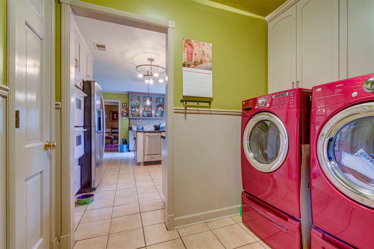 158 South Perkins Road Memphis, TN 38117 - Photo 8 of 25 Back laundry room has cabinets above as well as a broom closet and double wide pantry closet
