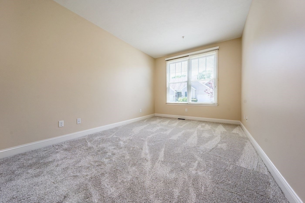 45 Grey Hawk Drive, Unit 45 Mashpee, MA 02649 - Photo 12 of 21 an empty room with windows