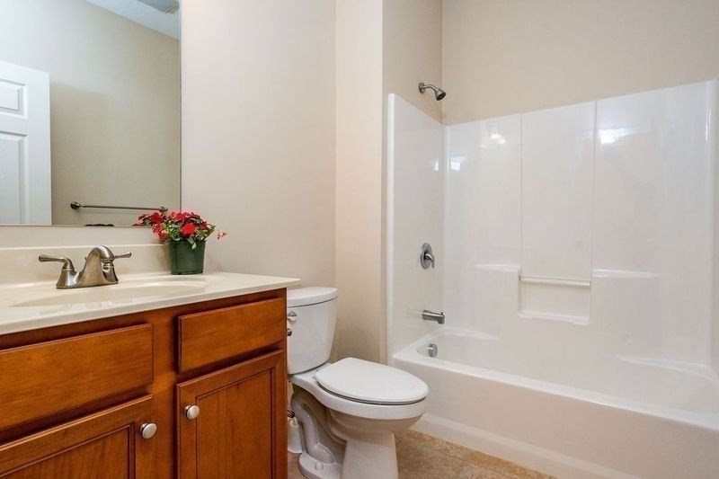 45 Grey Hawk Drive, Unit 45 Mashpee, MA 02649 - Photo 14 of 21 a bathroom with a sink toilet and shower
