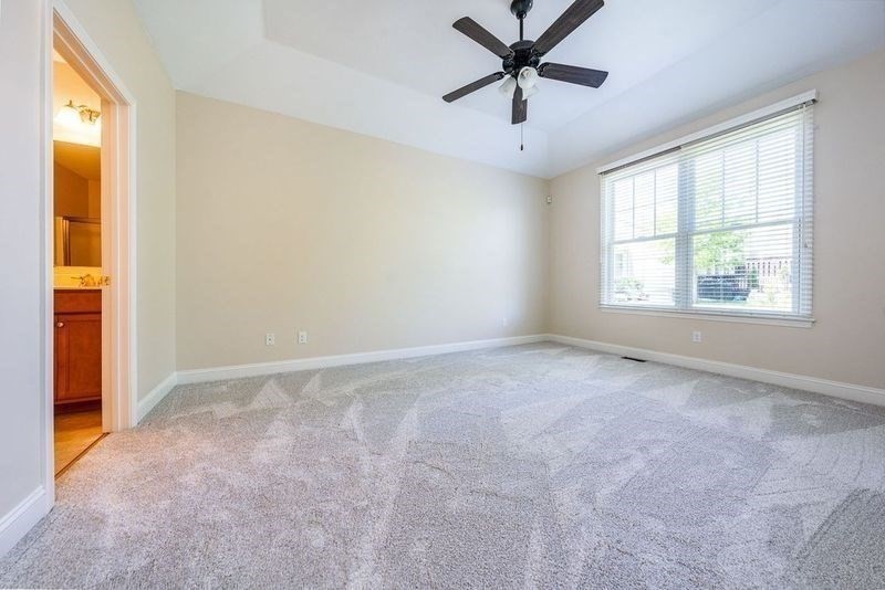 45 Grey Hawk Drive, Unit 45 Mashpee, MA 02649 - Photo 8 of 21 an empty room with a window and a fan