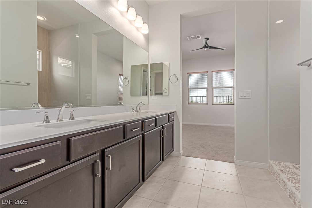 298 Nine Mile Creek Drive Las Vegas, NV 89138 - Photo 12 of 30 Full bathroom with double vanity, light tile patterned flooring, ceiling fan, and recessed lighting