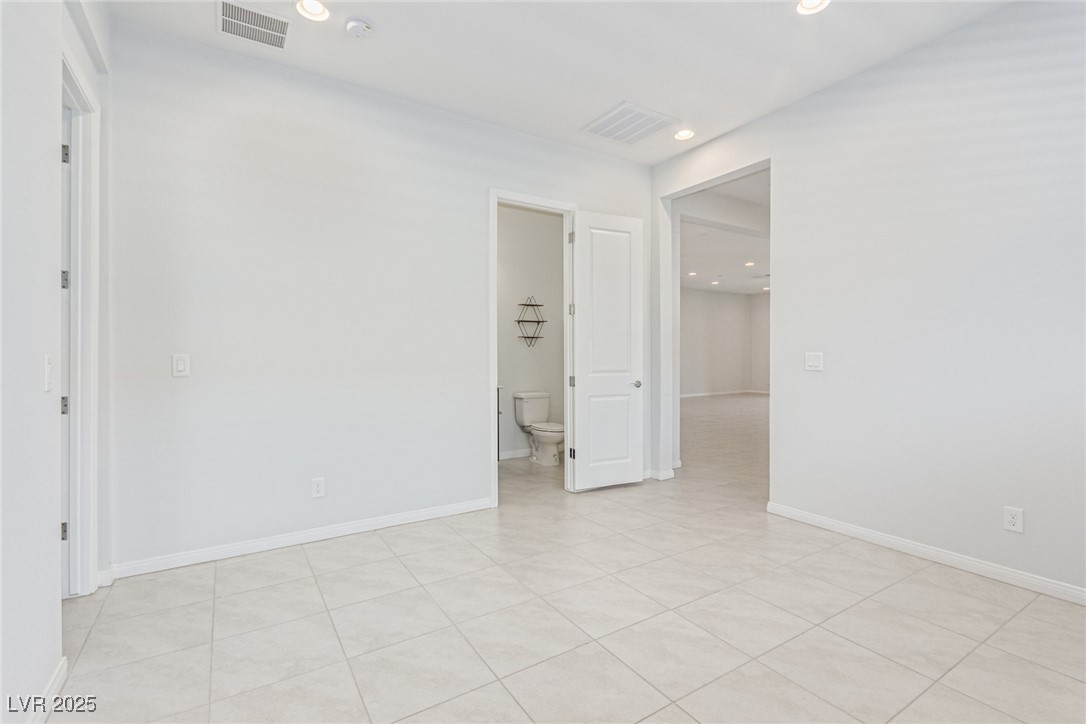 298 Nine Mile Creek Drive Las Vegas, NV 89138 - Photo 19 of 30 Unfurnished room featuring recessed lighting and light tile patterned flooring