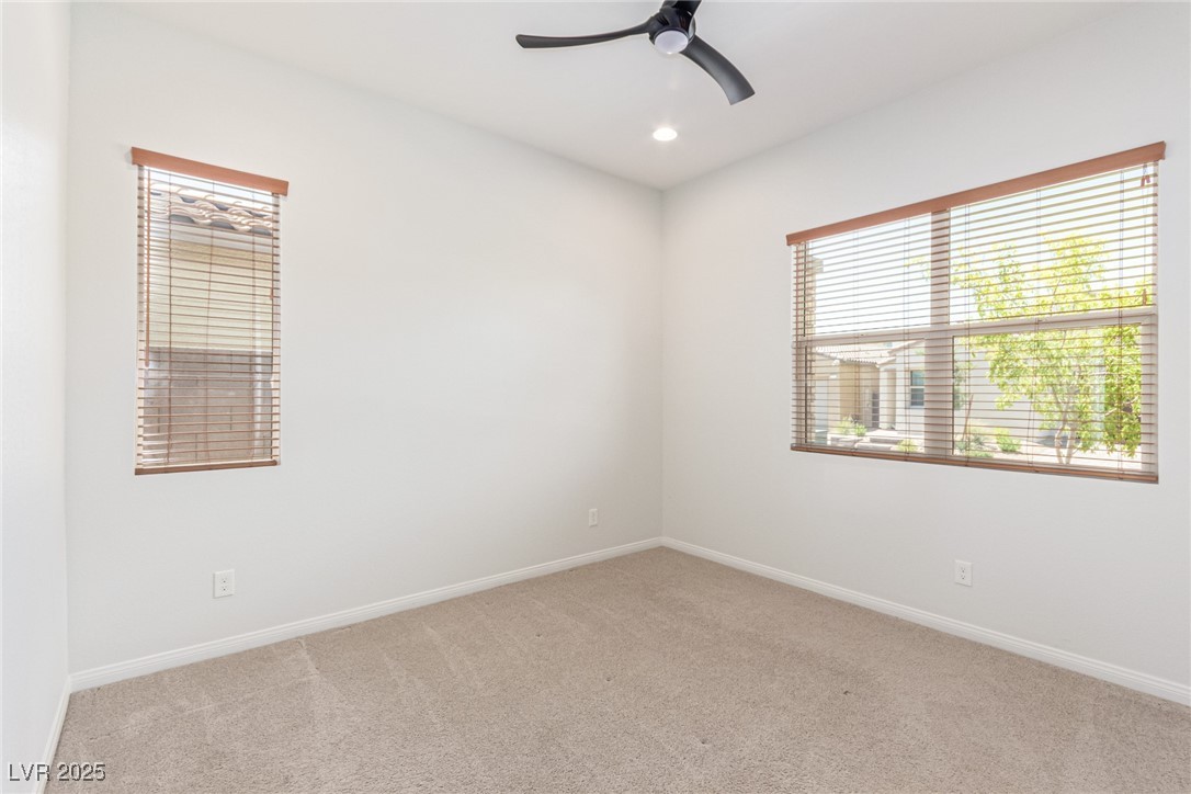 298 Nine Mile Creek Drive Las Vegas, NV 89138 - Photo 21 of 30 Unfurnished room with light carpet, ceiling fan, and recessed lighting