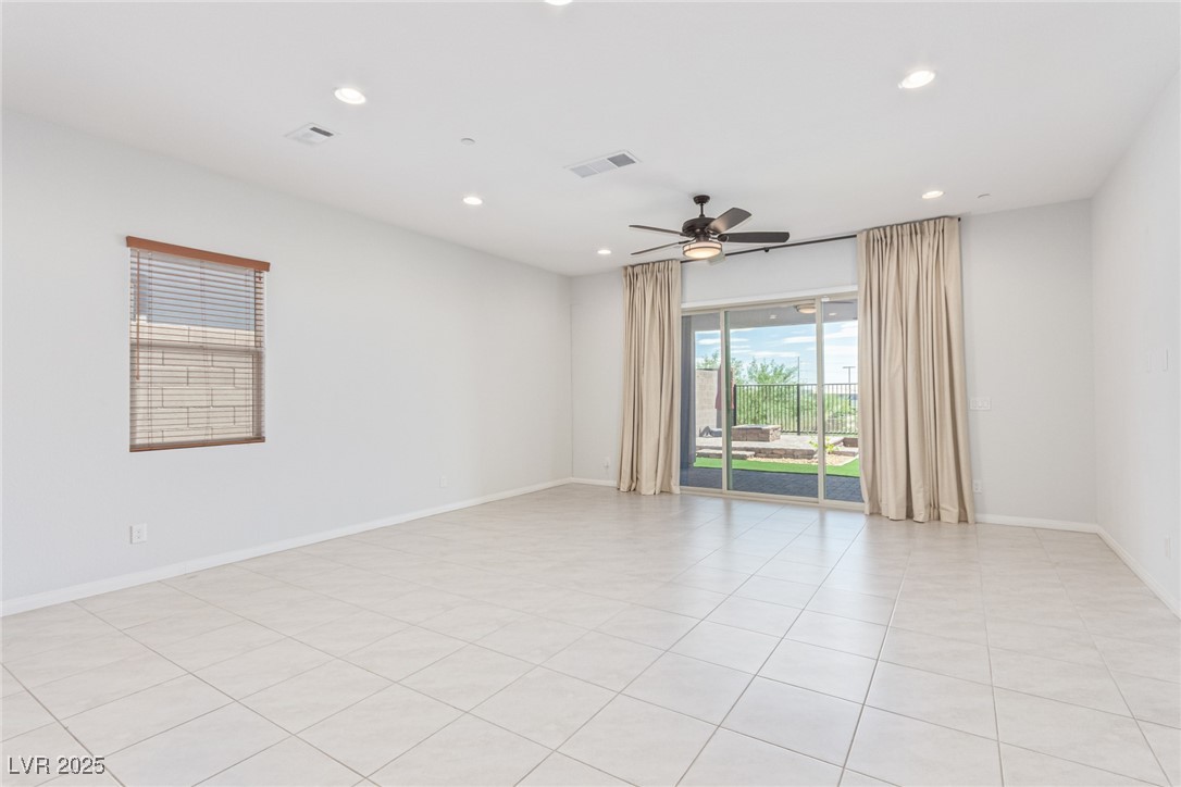 298 Nine Mile Creek Drive Las Vegas, NV 89138 - Photo 3 of 30 Empty room with recessed lighting, light tile patterned flooring, and a ceiling fan