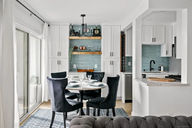 a view of a dining room with furniture window and kitchen view