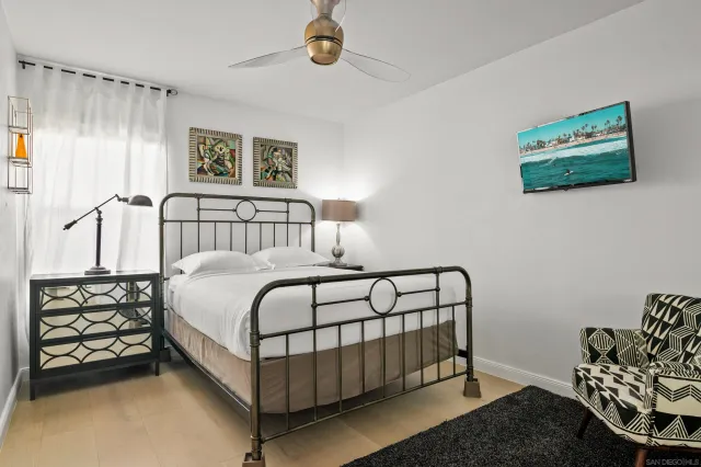 a bedroom with a bed and a couch