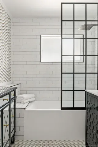 a living room with furniture a ceiling fan and a flat screen tv