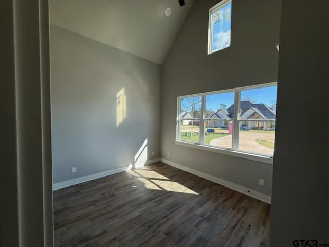 a view of a room with wooden walls and floor