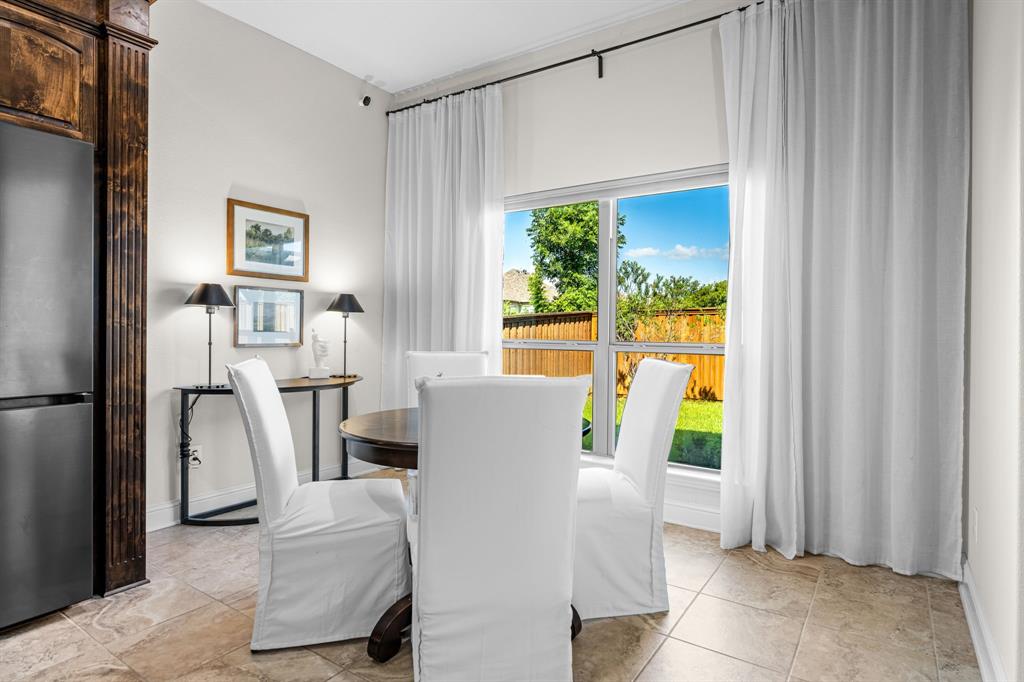 8 Center Court Heath, TX 75032 - Photo 17 of 34 a living room with furniture and a window