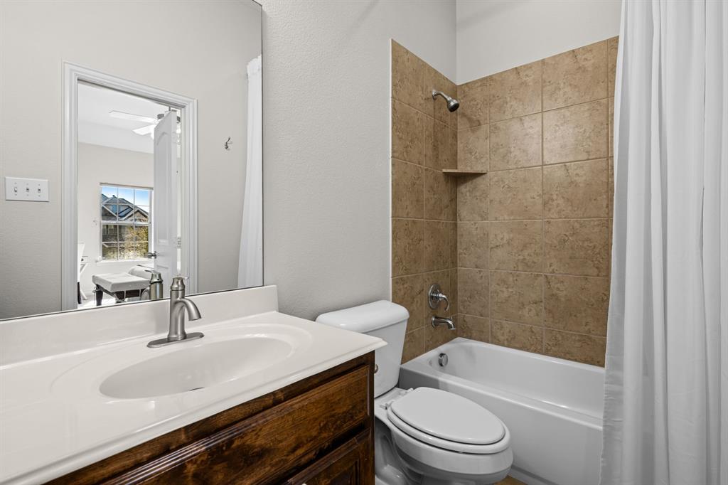 8 Center Court Heath, TX 75032 - Photo 24 of 34 a bathroom with a sink toilet and shower