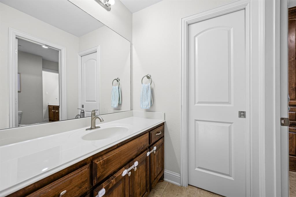 8 Center Court Heath, TX 75032 - Photo 26 of 34 a bathroom with a sink and a mirror