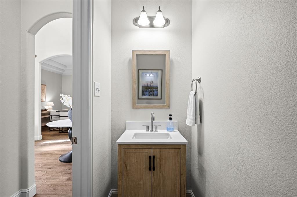 8 Center Court Heath, TX 75032 - Photo 31 of 34 a bathroom with a sink and a mirror