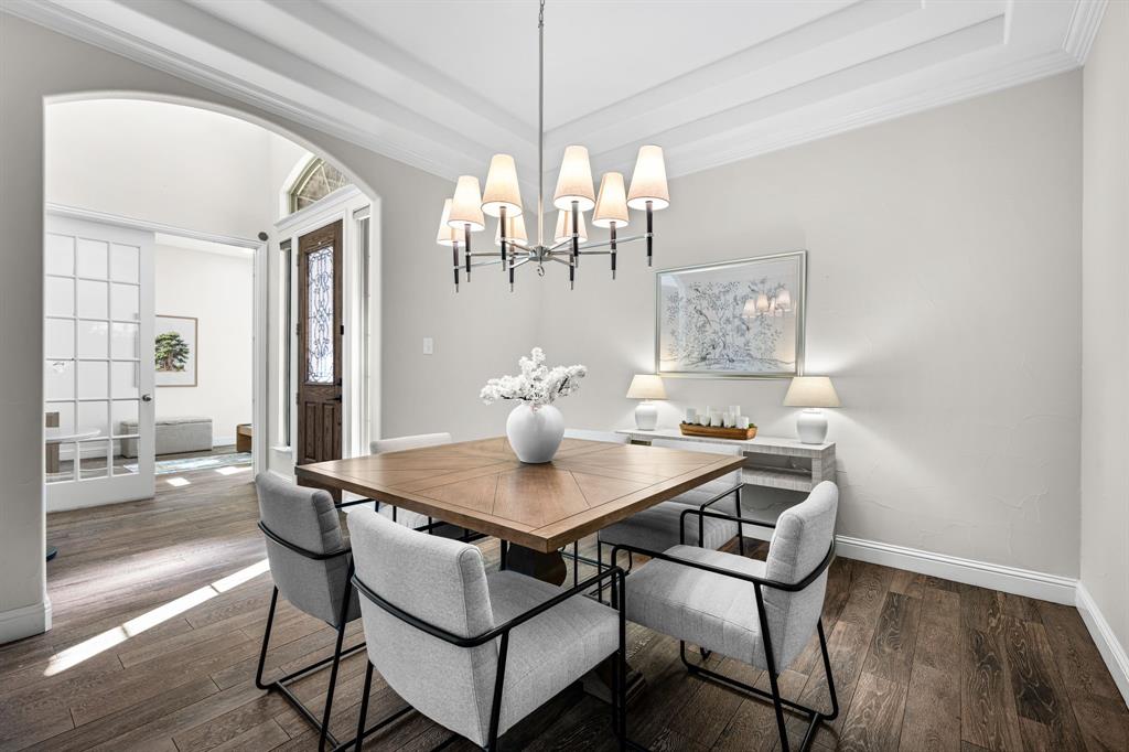 8 Center Court Heath, TX 75032 - Photo 7 of 34 a view of a dining room with furniture wooden floor and chandelier
