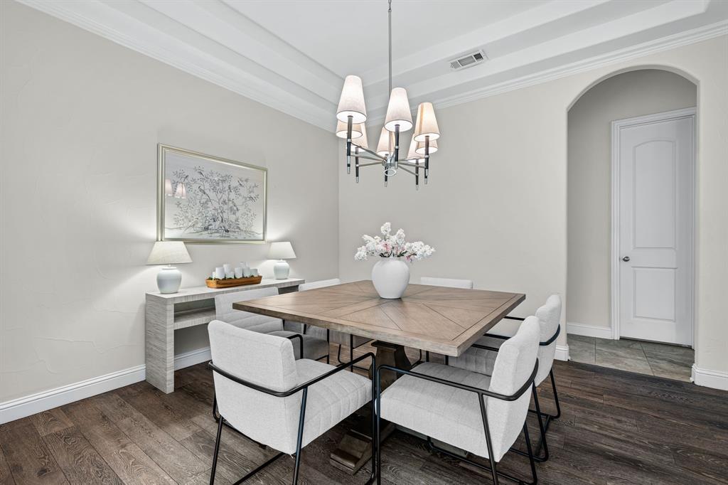 8 Center Court Heath, TX 75032 - Photo 8 of 34 a view of a dining room with furniture wooden floor and chandelier